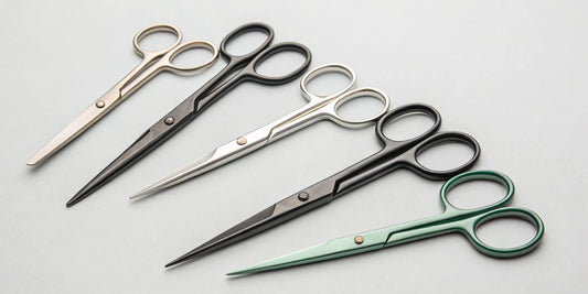 Several pairs of curved trimming scissors used for precise bud and plant trimming.
