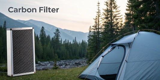A carbon filter positioned for setup inside or outside of a grow tent.